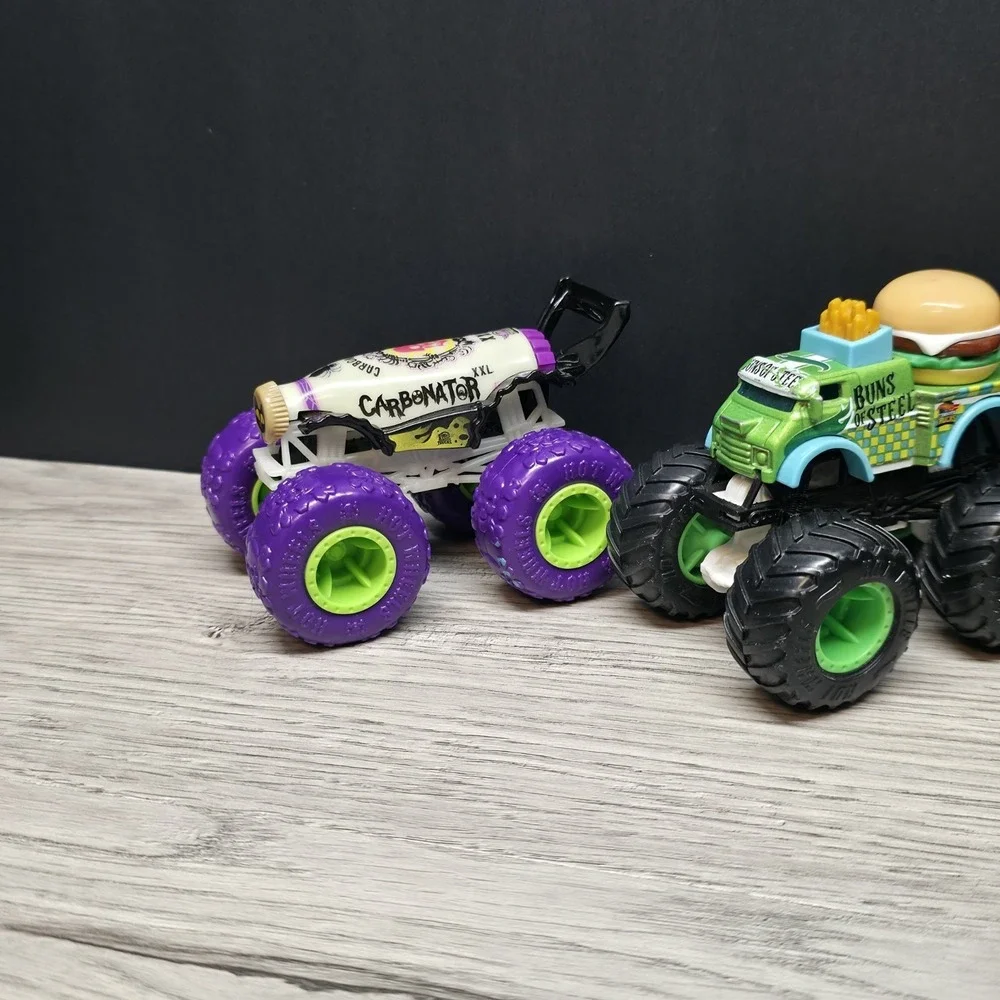 Hotwheels Monster Trucks Lot - Carbonator, Buns Of Steel, Unimog, And Tuk N Roll